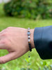 Adjustable Men's Bracelet with Tiger Eye and Black Beaded Symbol Detail