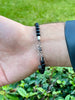 Adjustable Men's Bracelet with Tiger Eye and Black Beaded Symbol Detail